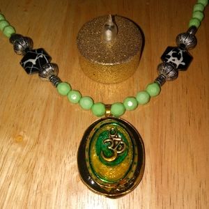New Om emblem necklace